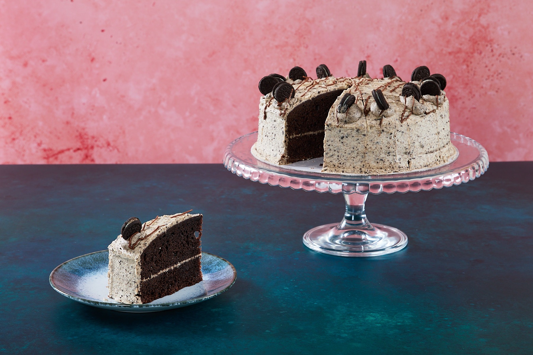 Cookies and Cream Cookies and cream cake with chocolate cookie pieces and cream frosting.